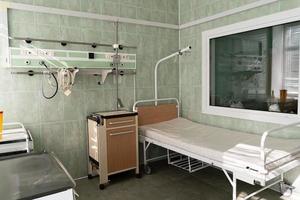 an empty bed in a hospital room. photo