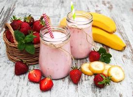 Yogurt with strawberries and bananas photo