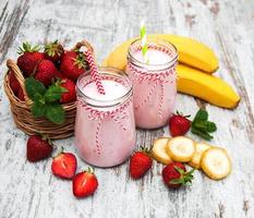 Yogurt with strawberries and bananas photo