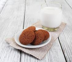 oatmeal cookies and glass of milk photo