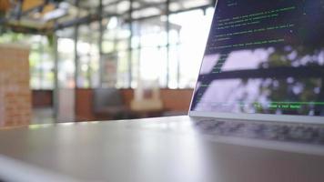 Close up laptop on the table at cafe, working at cafe.IT careers. Code development. Waiting for the code running. Working as a programer freelance. working day concept video