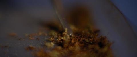 Trimming marijuana with scissors to roll a joint. Close up of weed being cut up. video