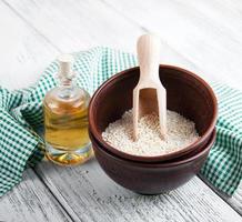 Sesame seeds and bottle with oil photo