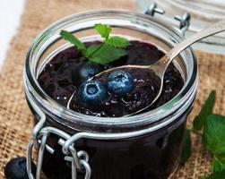 Jar with blueberry jam photo