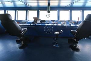 Wheelhouse control board of modern industry ship photo