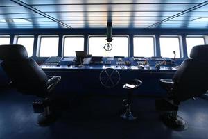 Wheelhouse control board of modern industry ship photo