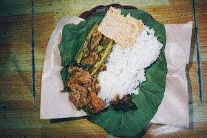 Nasi Jamblang or Sego Jamblang. Traditional rice dish from Cirebon, West Java, Indonesia. photo