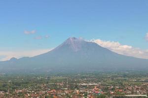 Aerial view of Mount Merapi Landscape with rice field and village in Yogyakarta, Indonesia Volcano Landscape View photo