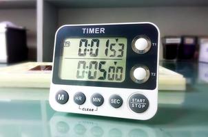 Closeup stop watch in laboratory. Timer. Laboratory test time counting concept.Stopwatch. photo