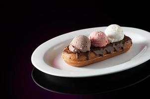Waffles and ice cream in a dish photo