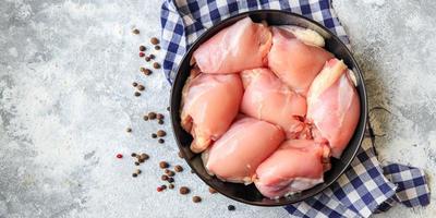 raw chicken or turkey skinless meat thigh boneless pulp poultry photo