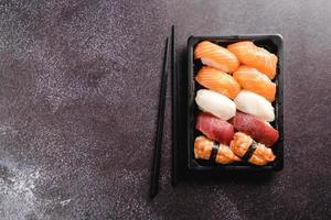 Sushi to go concept. Takeaway box with sushi photo