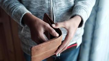 slow motion of man hand open an empty wallet with copy space.