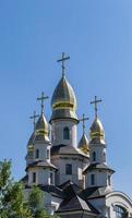 Christian church cross in high steeple tower for prayer photo