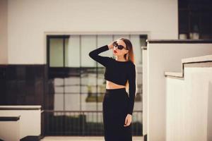 Portrait of a stylish woman in sunglasses outdoors. copy space photo