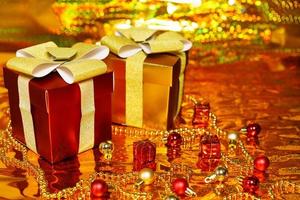 gift boxes on shiny gold background photo