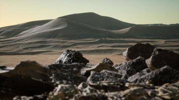 Aerial view on big sand dunes in Sahara desert at sunrise photo