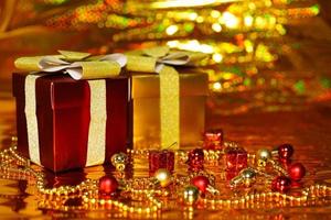 gift boxes on shiny gold background photo