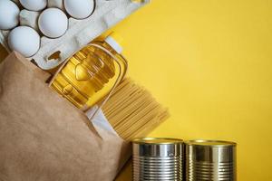 Package with products on a yellow background photo
