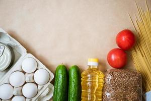 Products lie on the background, eggs cereals and vegetables photo