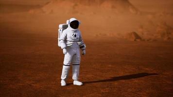 Astronaut on Mars Surface. Red Planet Covered in Gas and rock photo