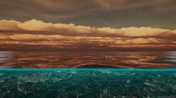 Split view over and under water in the Caribbean sea with clouds photo