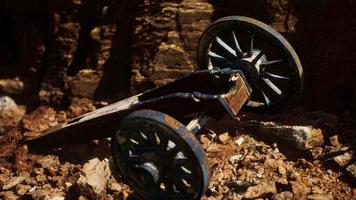 ancient historic gun in the stone canyon photo