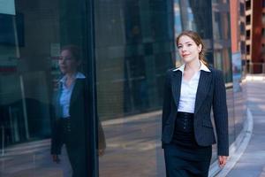 Young business woman of the office center on the street photo