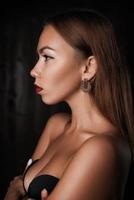 portrait of a beautiful girl on a dark background photo