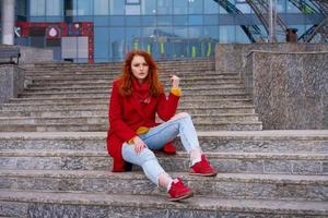 portrait of a young woman in a red coat photo