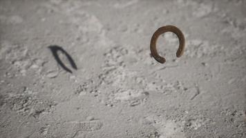 extreme slow motion old rusty metal horseshoe photo