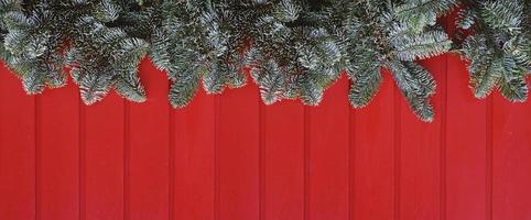 christmas decoration web banner or header image with red wood and green fir branches photo