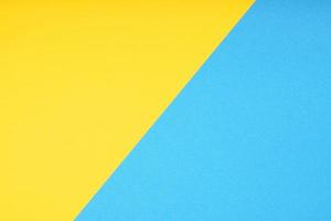 two color paper background in yellow and blue photo
