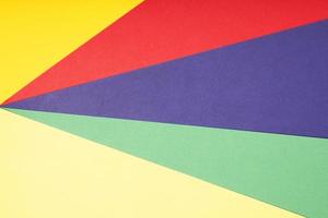 multicolor paper background in red pruple green and yellow photo