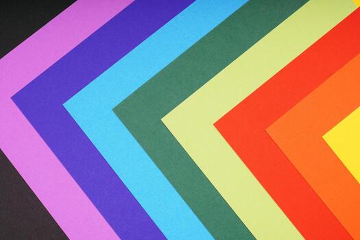 rainbow colored paper background with angular pattern photo