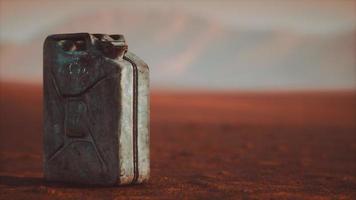 old rusty fuel canister in the desert photo