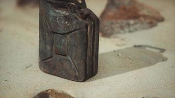 old rusty fuel canister in the desert photo