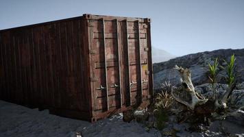 abandoned shipping container in the desert photo