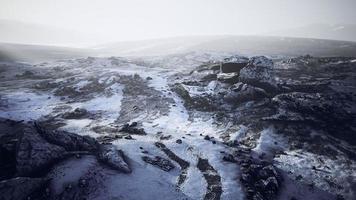 Antarctic mountains with snow in fog photo