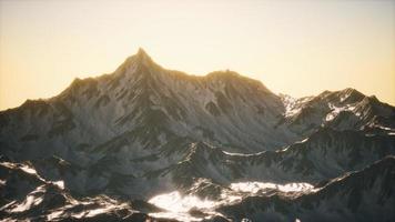 Aerial view of the Alps mountains in snow photo