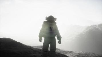 astronaut on another planet with dust and fog photo