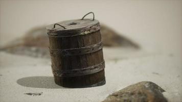 old wooden basket on the sand at the beach photo