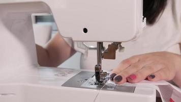 Woman Tailor Working with sewing Machine at Home video