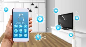 Hand of woman or man holding smartphone in house with icons in modern life internet of things, smart home technology. concept of automation. the new innovation of the future in living room photo