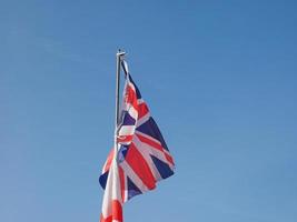 UK Flag over blue sky photo