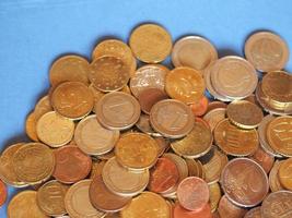 Euro coins, European Union over blue with copy space photo