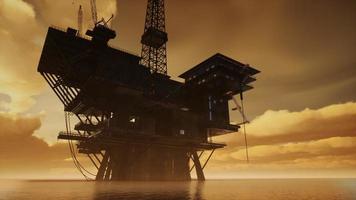 Offshore Jack Up Rig in The Middle of The Sea at Sunset Time photo