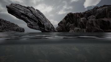 Half underwater in northern sea with rocks photo