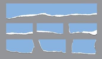 A collection of blue torn paper strips. Vector files on grey background.