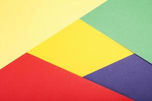 multicolor paper background in red pruple green and yellow photo